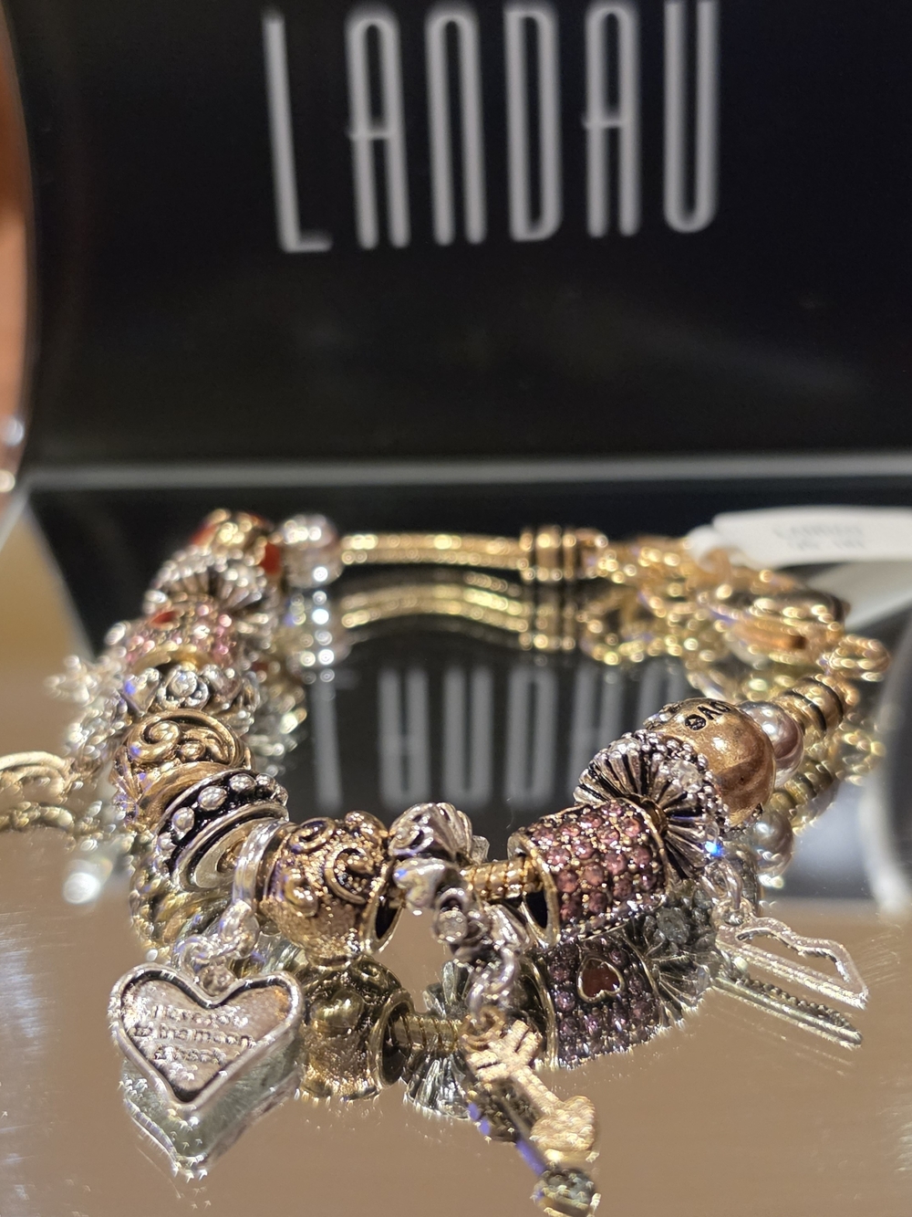 Landau Gold-Tone Charm Bracelet with Pink Accents